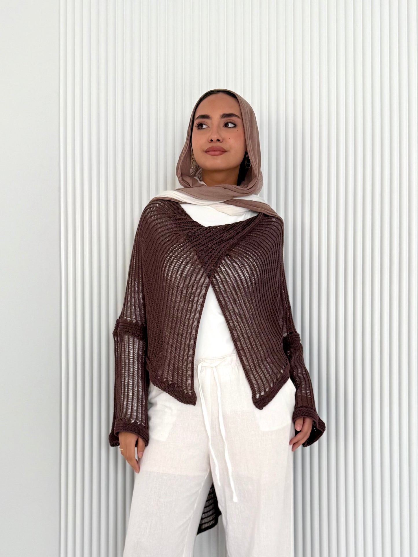 Brown convoluted high and low knitted top