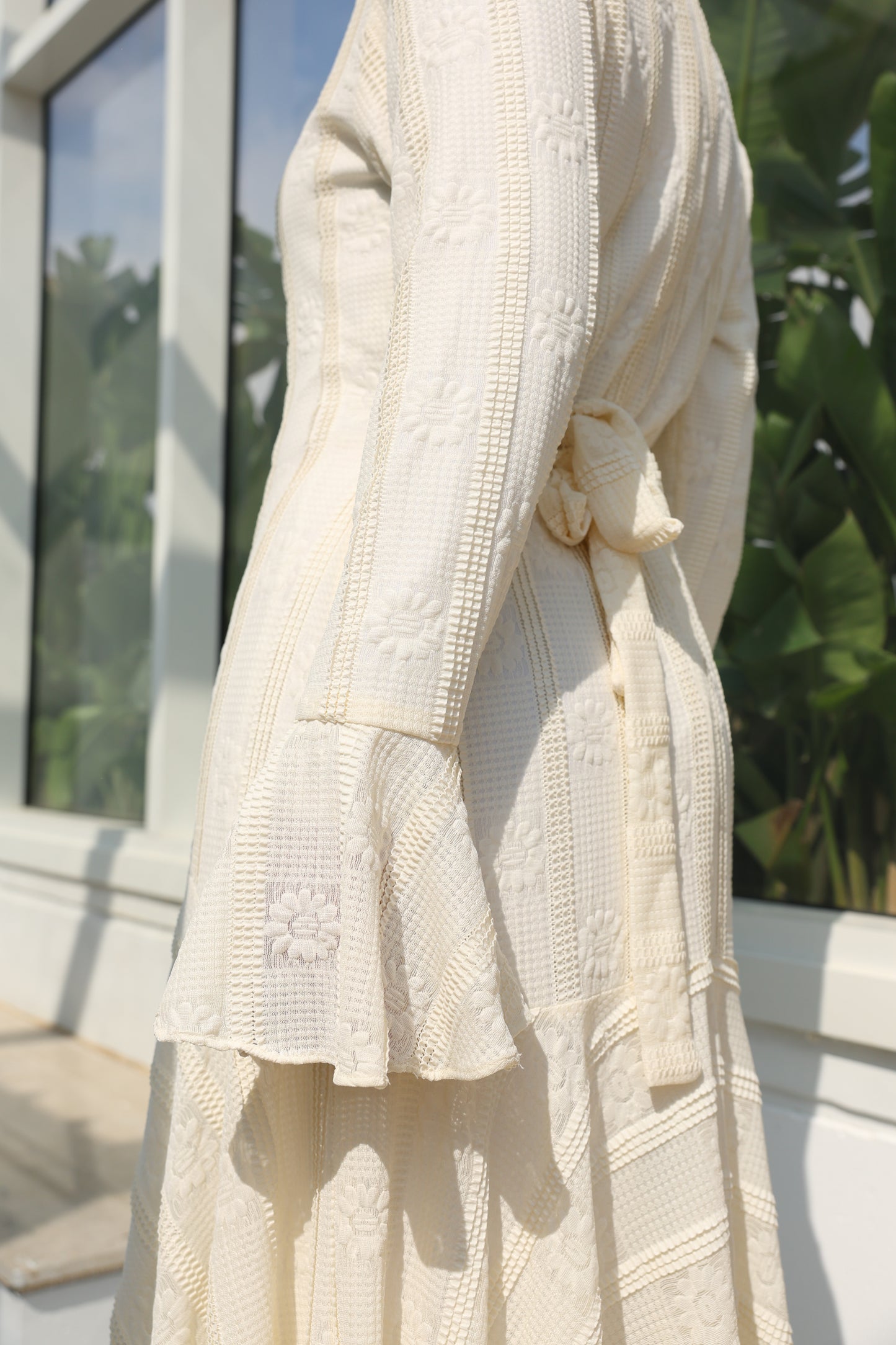 lace dress with a unique design in brown , fully lined." فستان من الدانتيل الفاخرباللون الكريم، يجسد براعة التصميم بتفاصيل فريدة وبطانة كامله ناعمة تمنحكِ رقياً لا يضاهى."