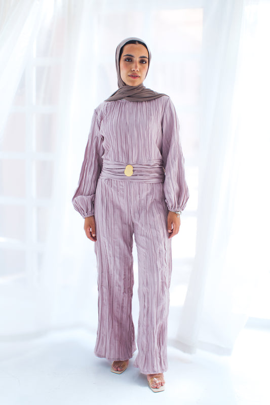 Shimmered crashed cotton jumpsuit in light mauve with golden brooch