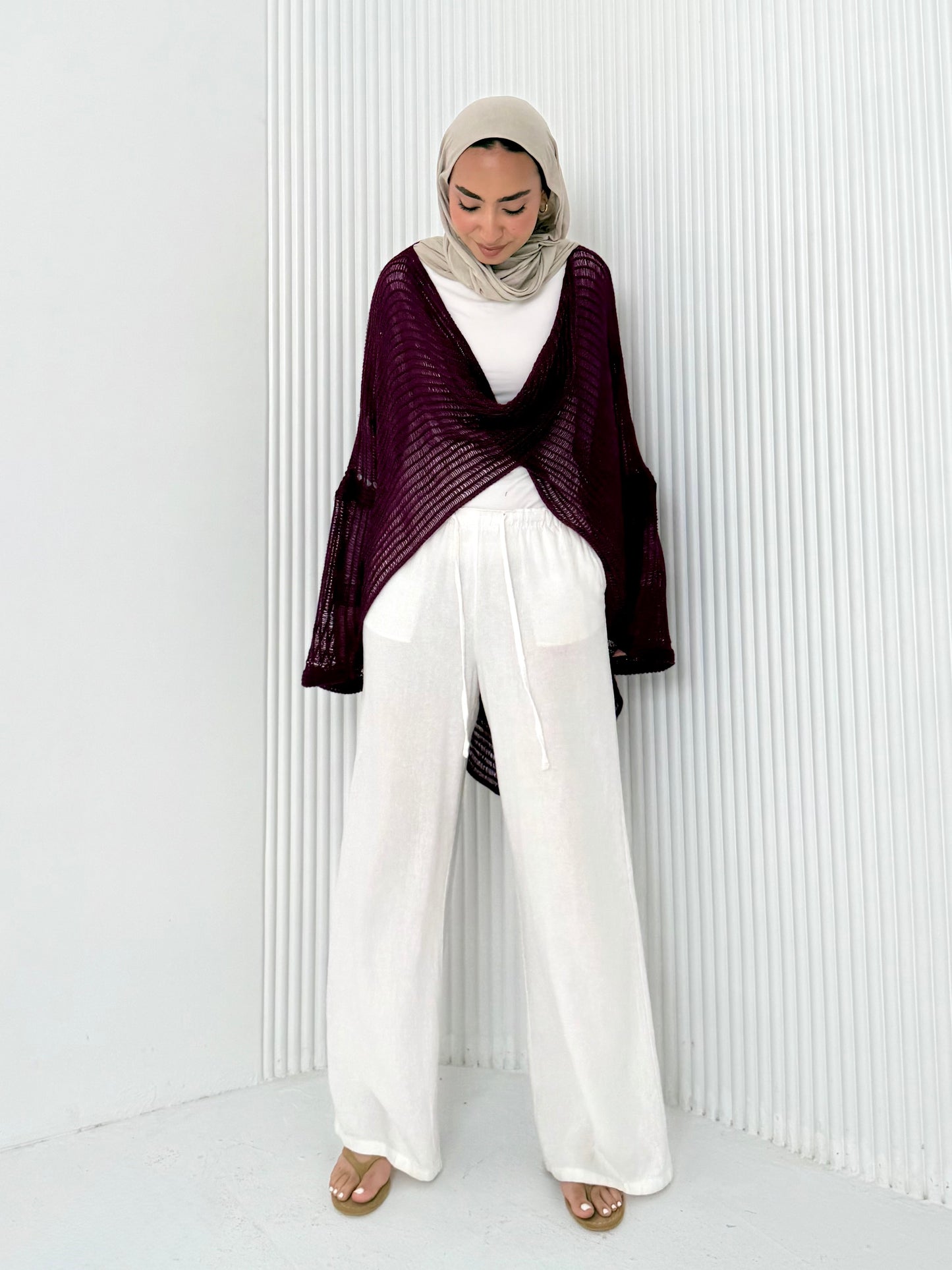 Burgundy convoluted high and low knitted top
