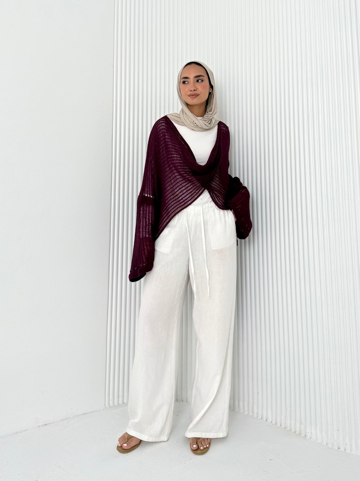 Burgundy convoluted high and low knitted top