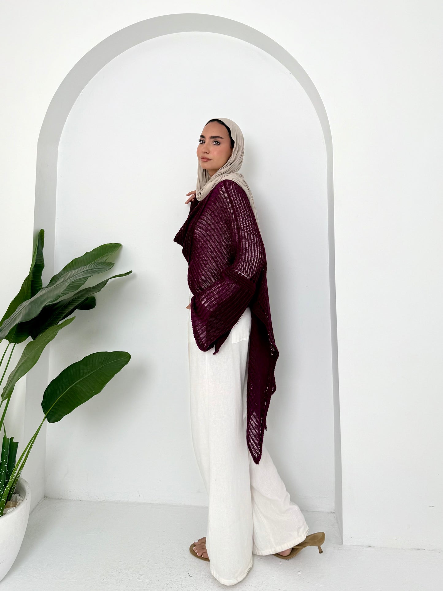 Burgundy convoluted high and low knitted top