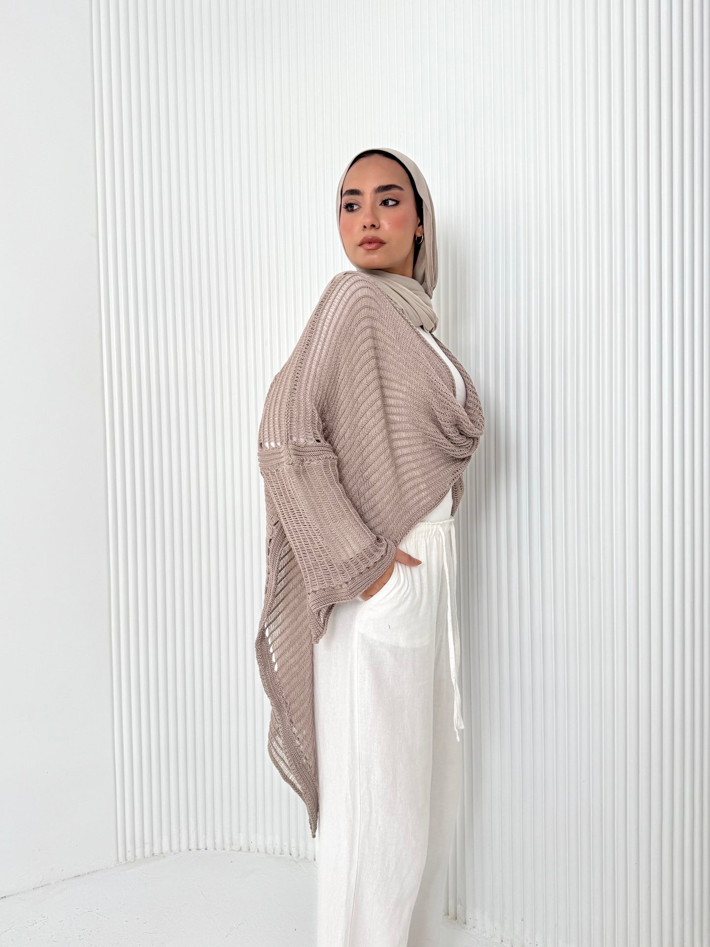 Caffee convoluted high and low knitted top