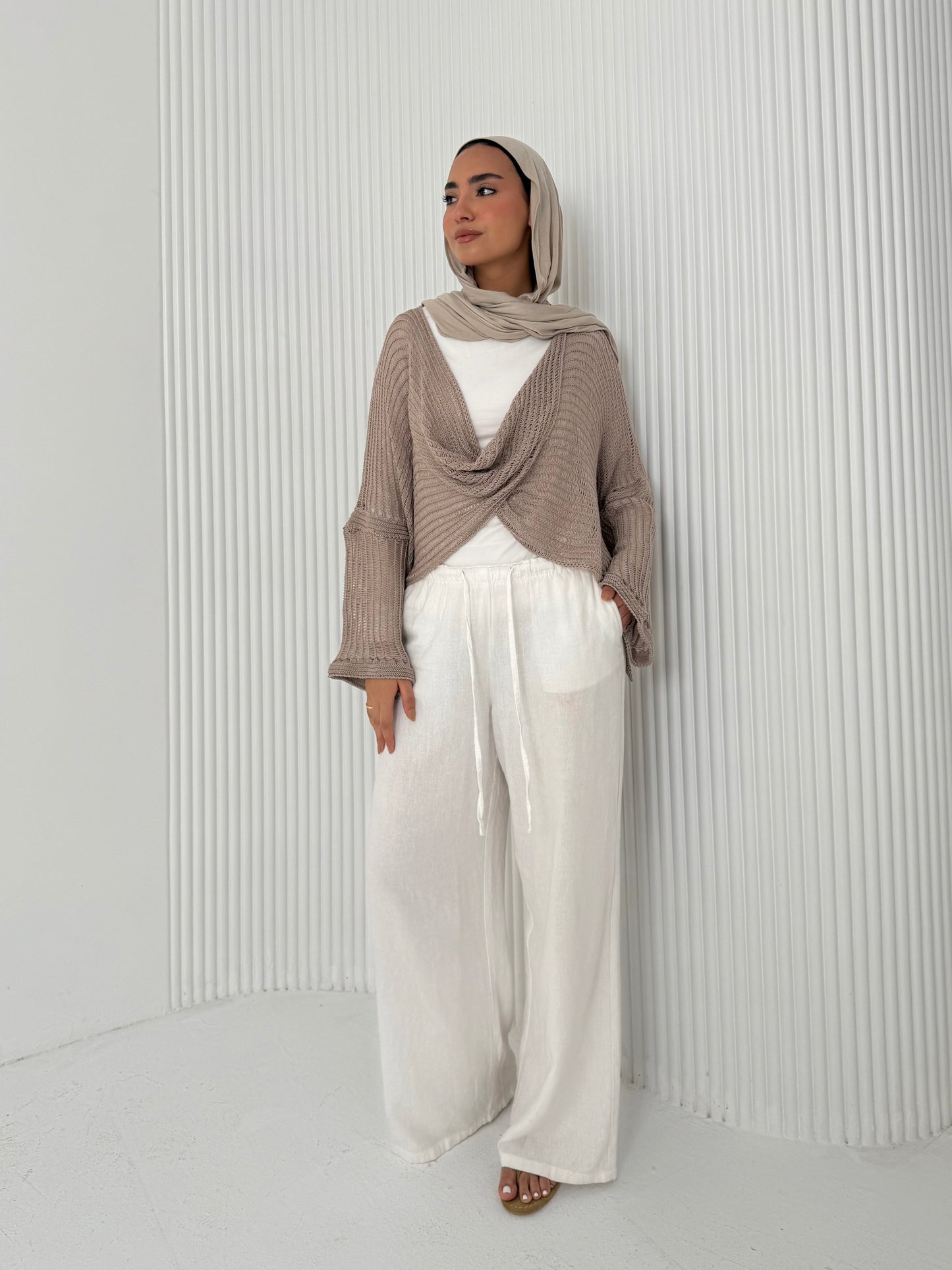 Caffee convoluted high and low knitted top