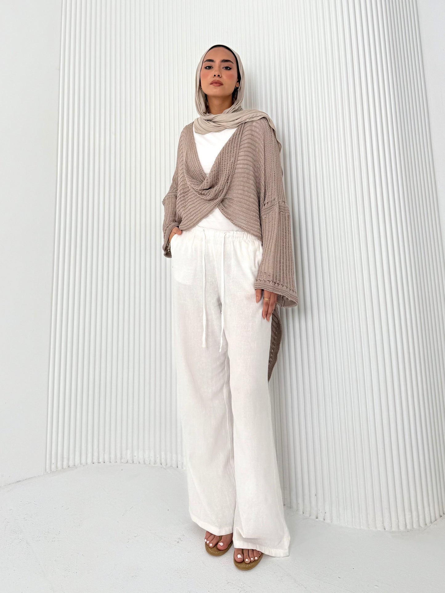 Caffee convoluted high and low knitted top
