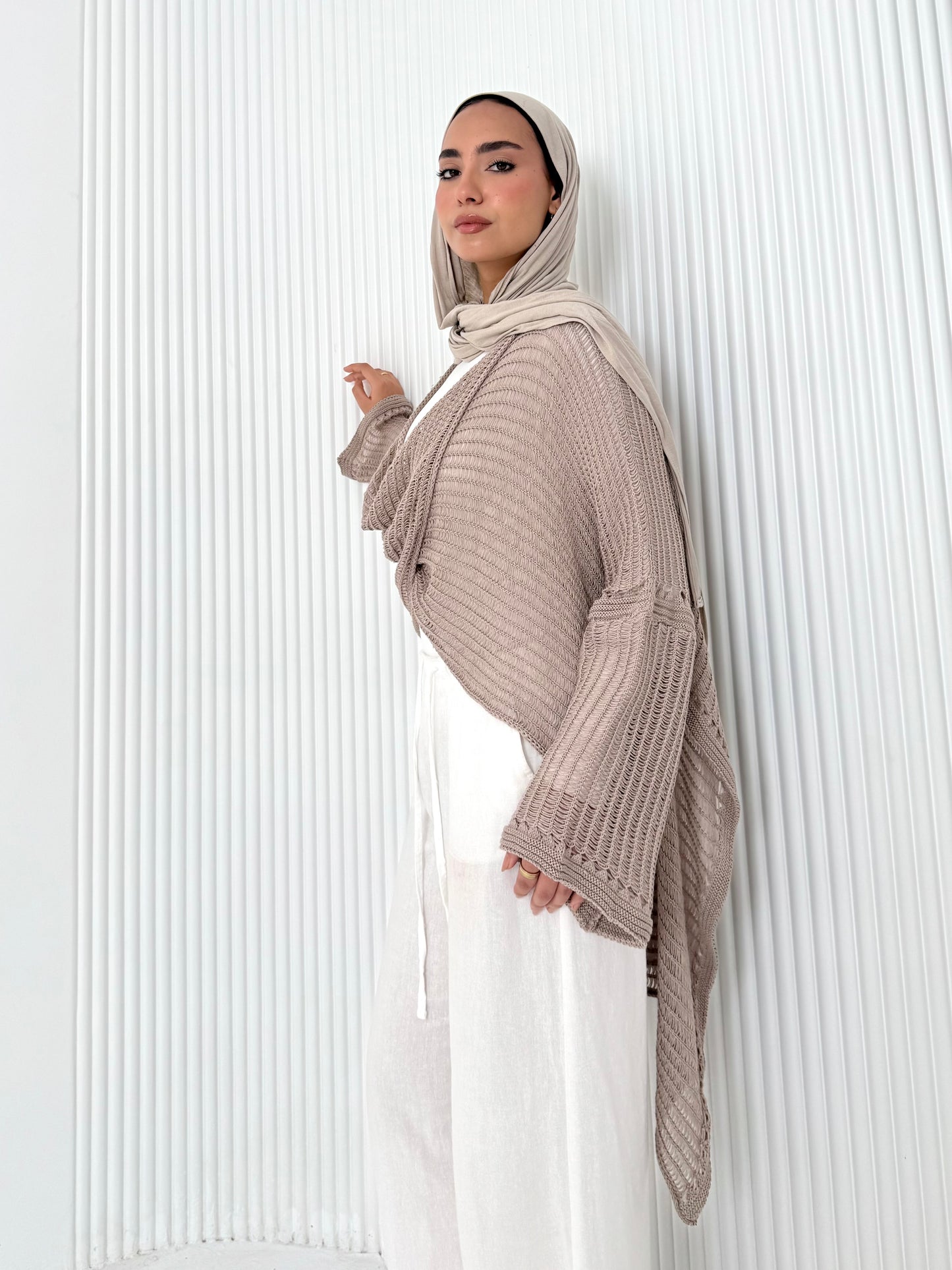 Caffee convoluted high and low knitted top