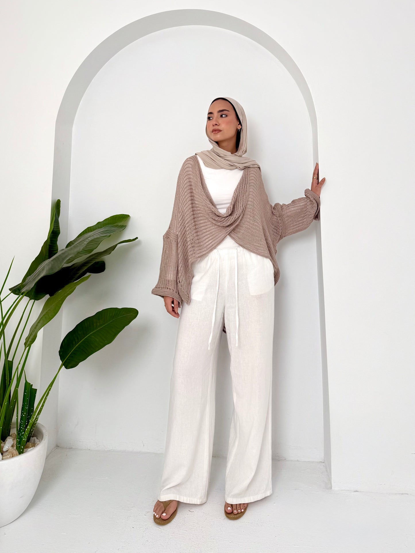 Caffee convoluted high and low knitted top