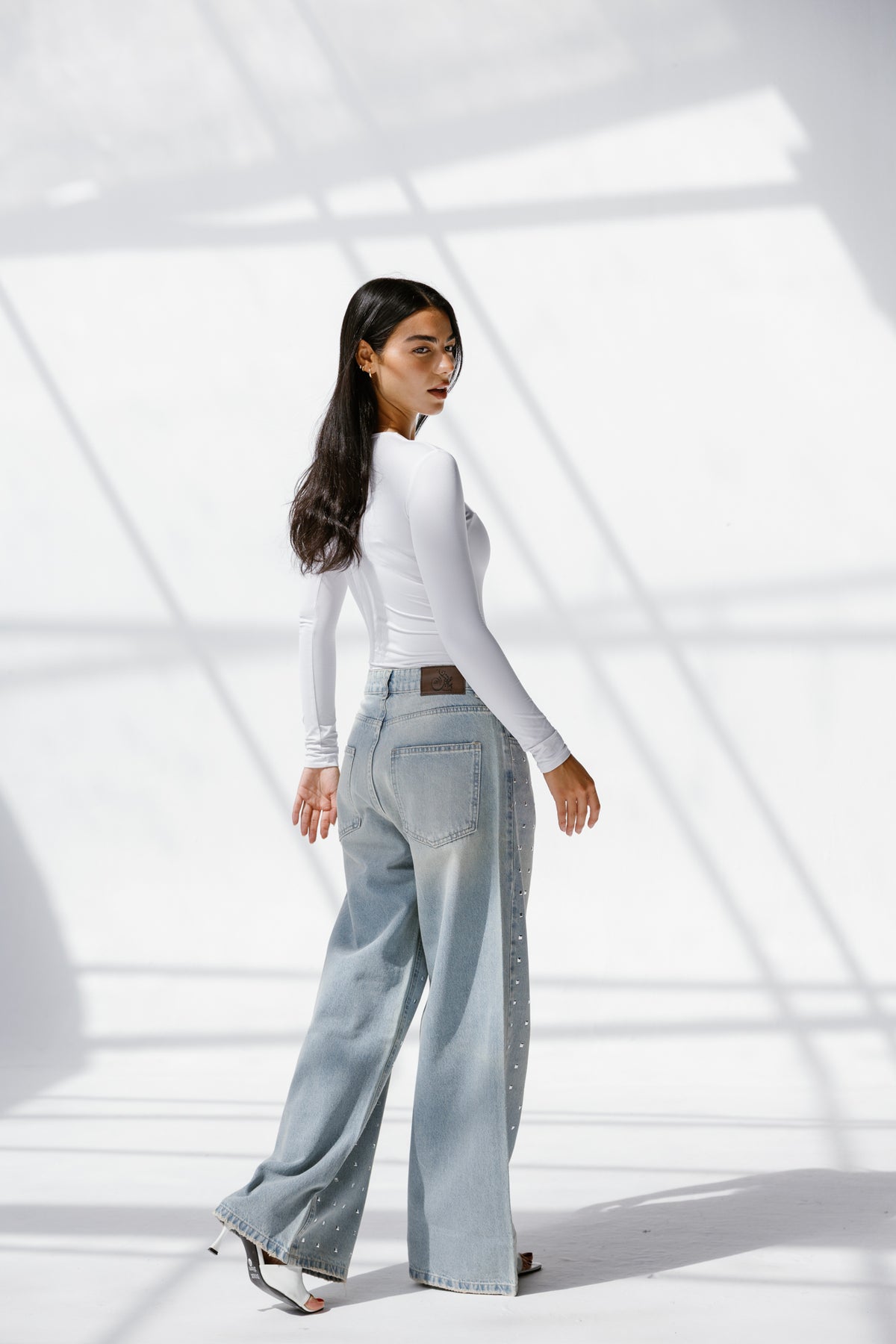 Twist Wide- leg denim pants Studs
